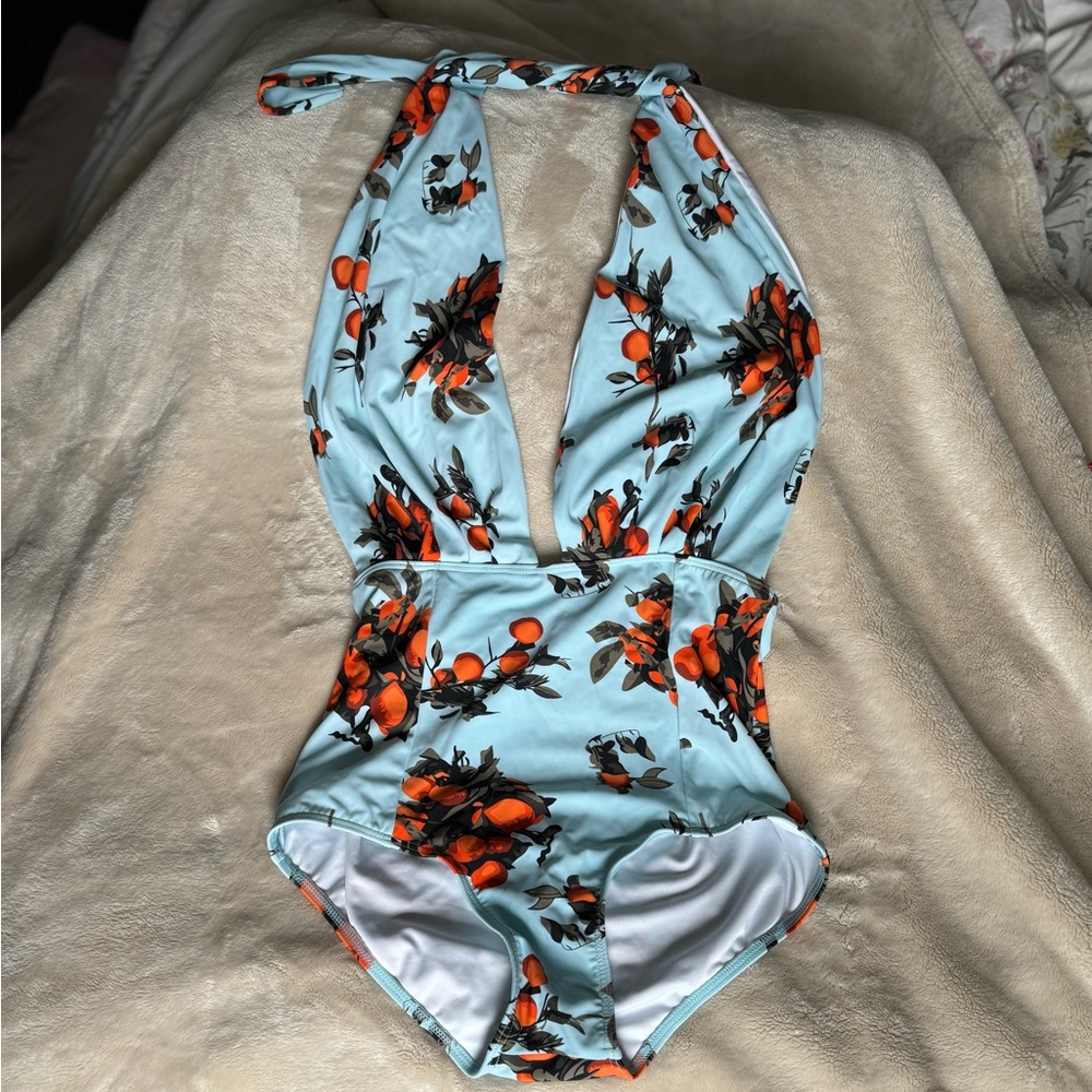 NWOT- Large, vintage style and print baby blue one piece bathing suit.